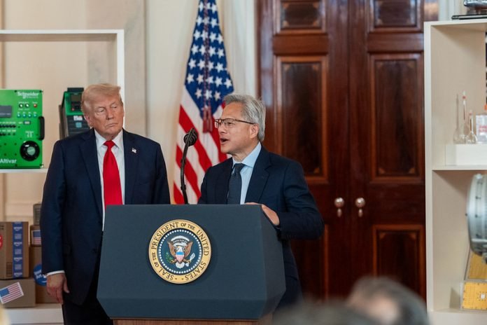 NVIDIA CEO Jensen Huang delivers remarks as President Donald Trump looks on during an “Investing in America” event, Wednesday, April 30, 2025