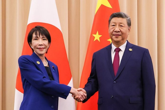 Japanese Prime Minister Sanae Takaichi with Chinese President Xi Jinping during the APEC South Korea 2025, 31 October 2025