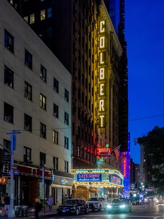 With Steven Colbert Signage