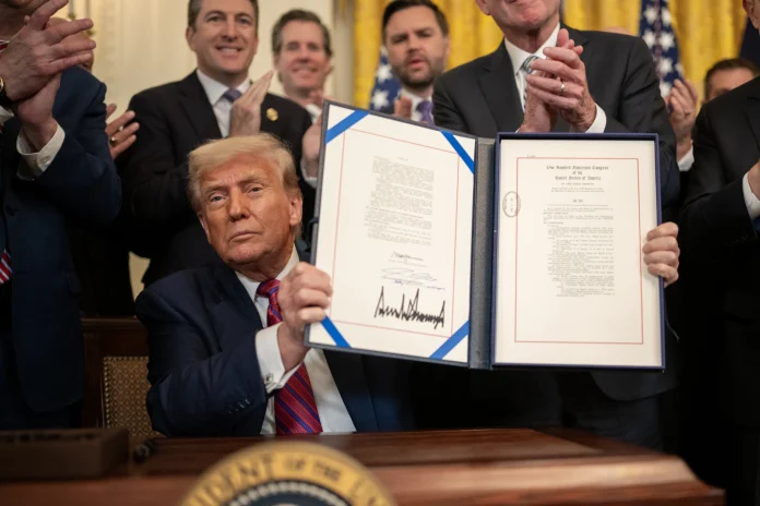 President Donald Trump signs S.1852, The GENIUS Act
