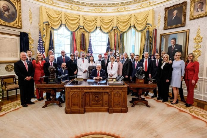 President Donald Trump signs an executive order reclassifying marijuana