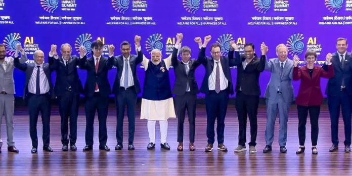 Prime Minister Narendra Modi joins hands with Google CEO Sundar Pichai, OpenAI CEO Sam Altman and others during the India AI Impact Summit 2026, in New Delhi
